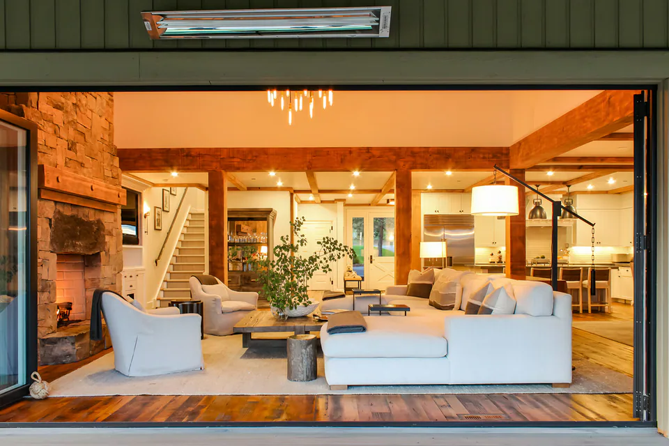 Great room at dusk at Cabin on the Fairway, Coeur d'Alene Lake, Idaho, interior design by Paul Lauren Designs