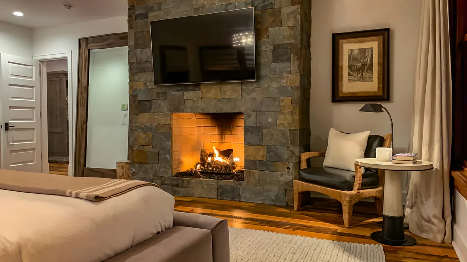 Primary bedroom at Cabin on the Fairway, Coeur d'Alene Lake, Idaho, interior design by Paul Lauren Designs