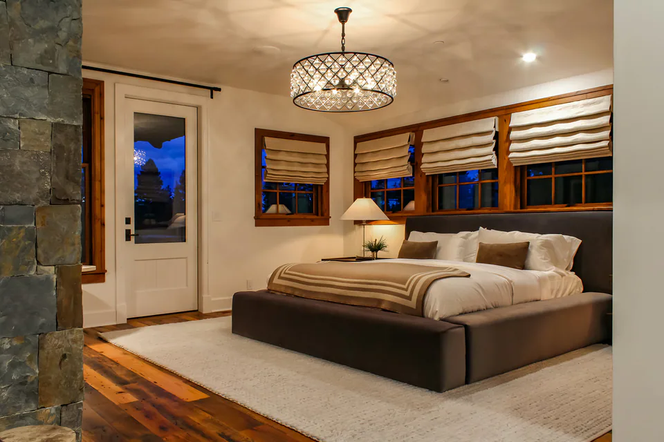 Primary bedroom at Cabin on the Fairway, Coeur d'Alene Lake, Idaho, interior design by Paul Lauren Designs