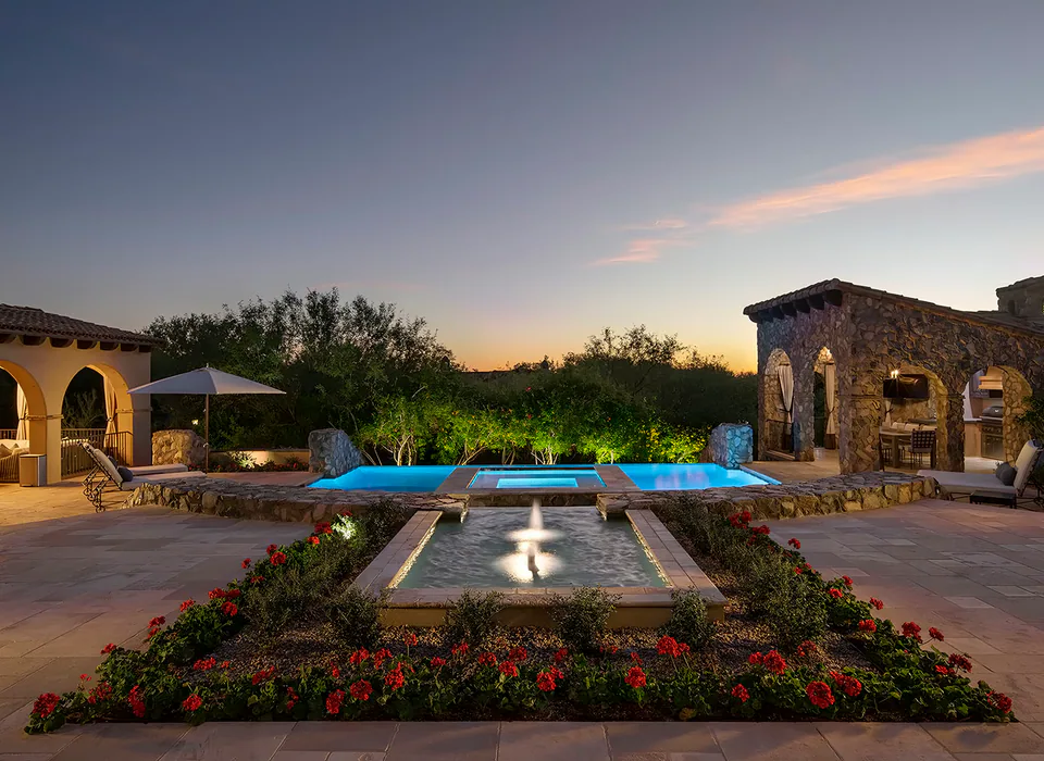 Pool courtyard at dusk at Silverleaf Mediterranean, North Scottsdale, Arizona, interior design by Paul Lauren Designs