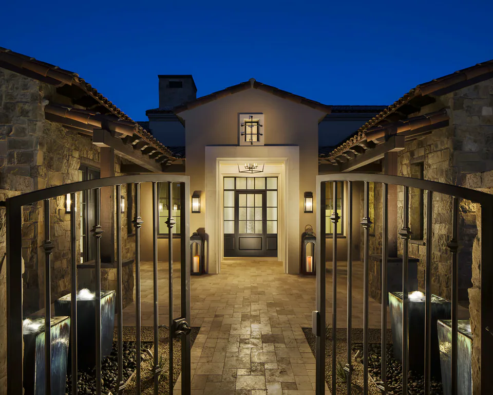 Entry courtyard at dusk at Silverleaf Transitional, North Scottsdale, Arizona, interior design by Paul Lauren Designs