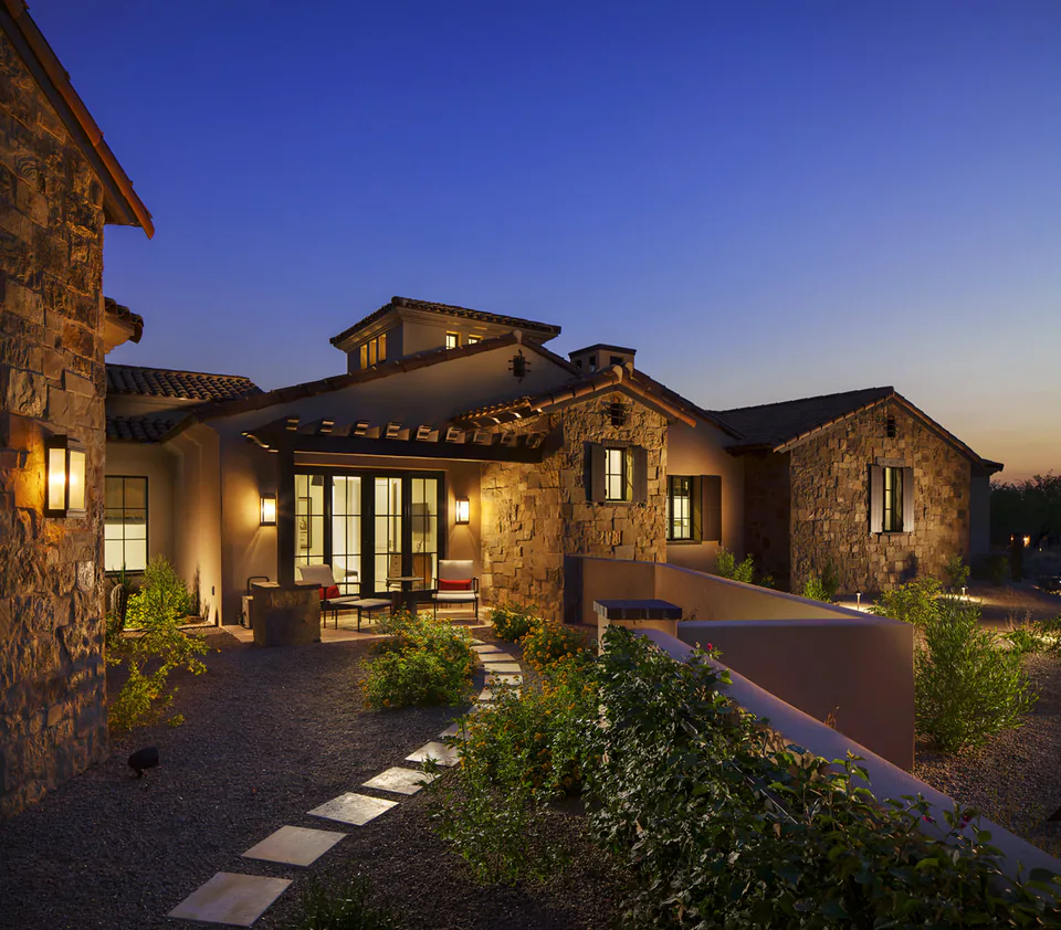 Exterior at dusk at Silverleaf Transitional, North Scottsdale, Arizona, interior design by Paul Lauren Designs